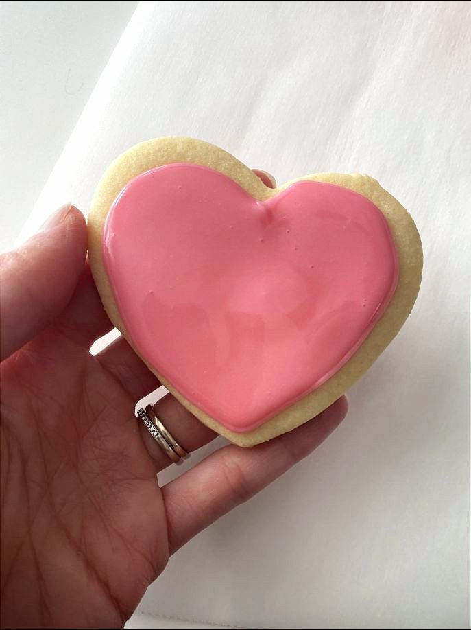 a finished heart cookie newly frosted